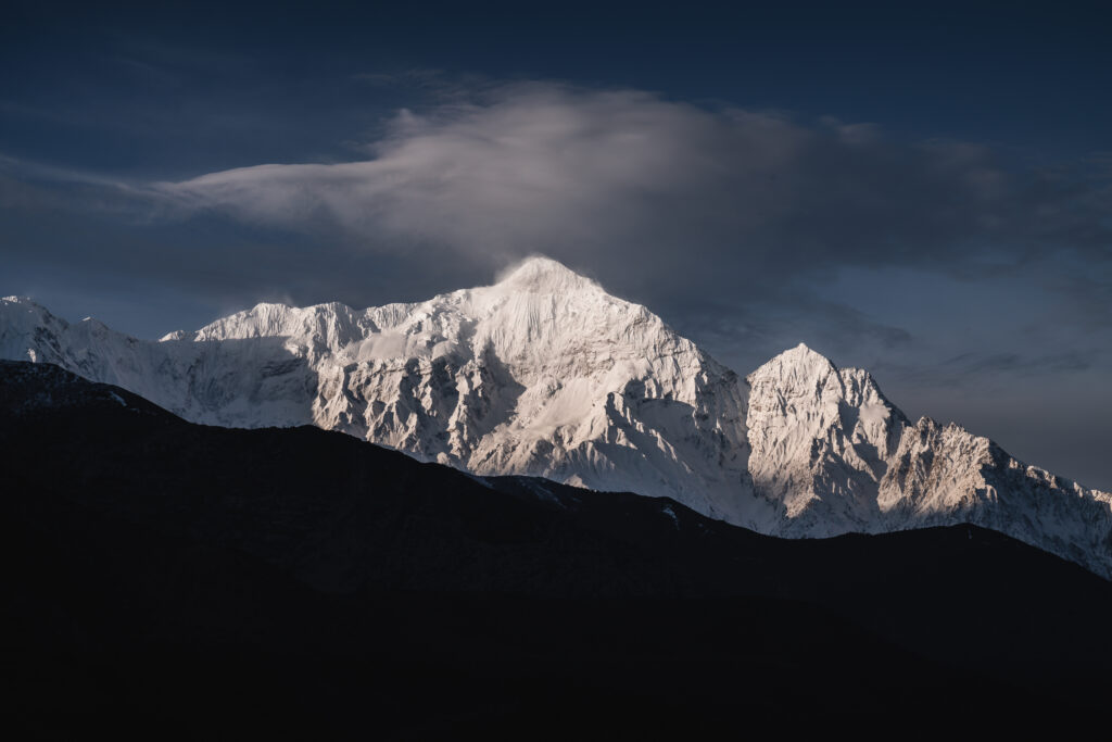 Nilgiri, which means Blue Mountain, towers above Jomsom, Nepal at sunrise.