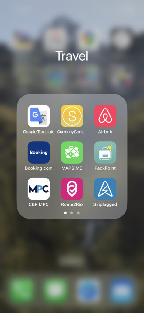 A screenshot of an iPhone folder labeled Travel with the following apps in the folder: Google Translate, CurrencyConverter, Airbnb, Booking.com, MAPS.ME, PackPoint, CBP MPC, Rome2Rio, and Skiplagged.
