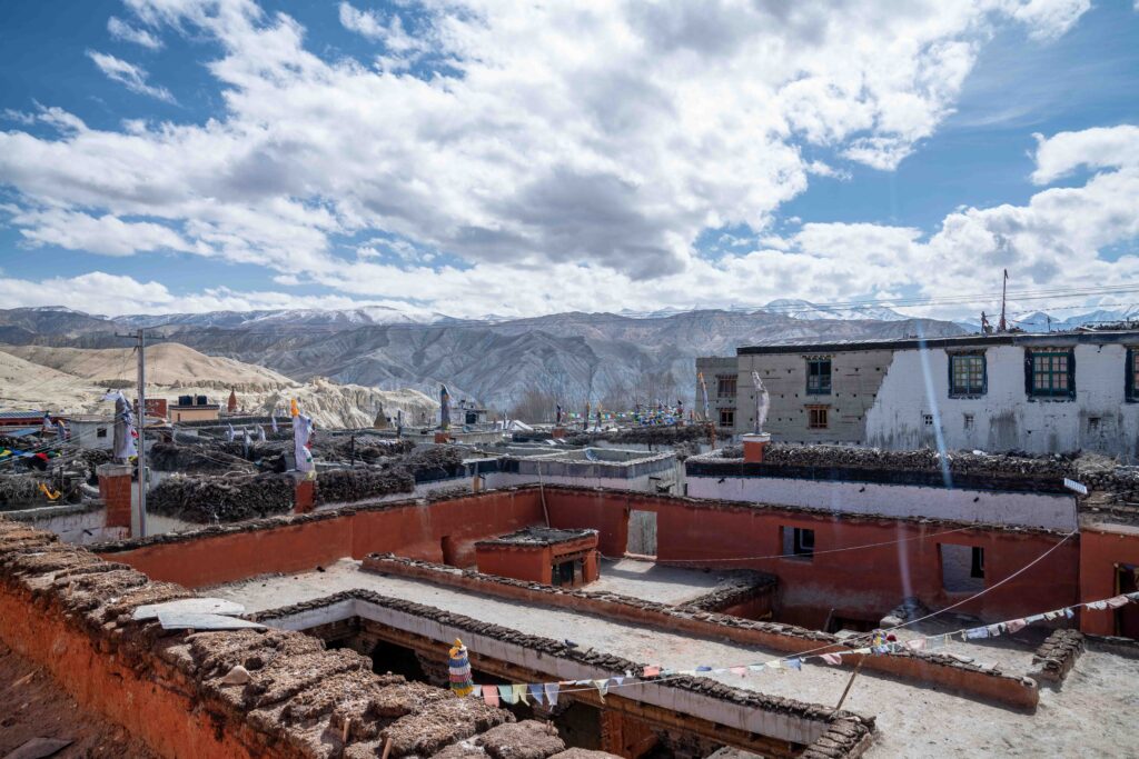 A view of the rooftops with snowcapped peaks in the background in Lo Manthang, Nepal.
