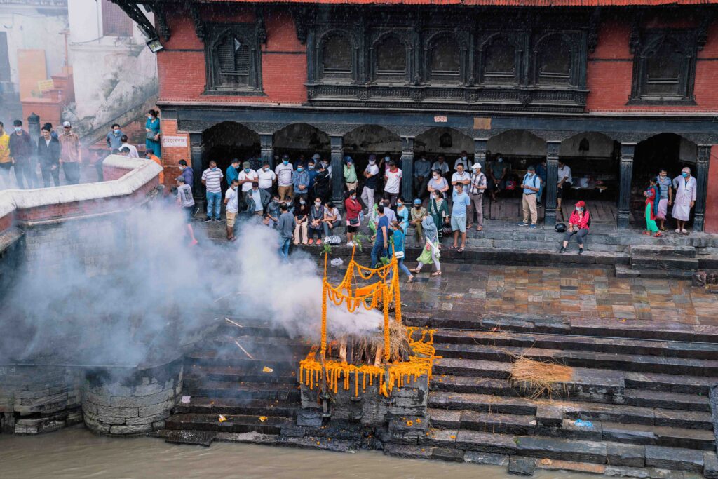 A burial and funeral ceremony on the river at Pashupati in Kathmandu.
